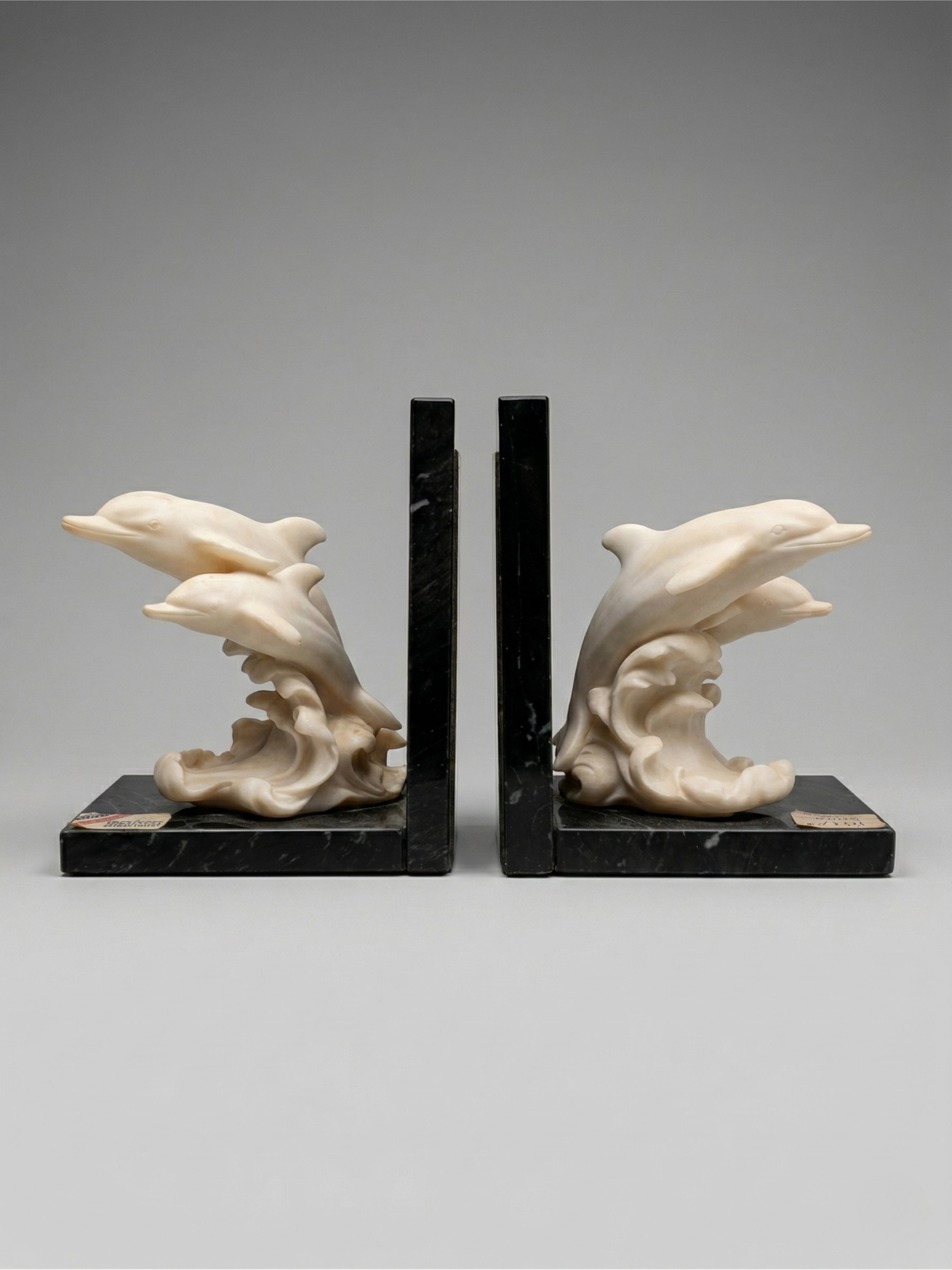 Pair of dolphin bookends – Ivory-effect resin & marble base – Art Deco style