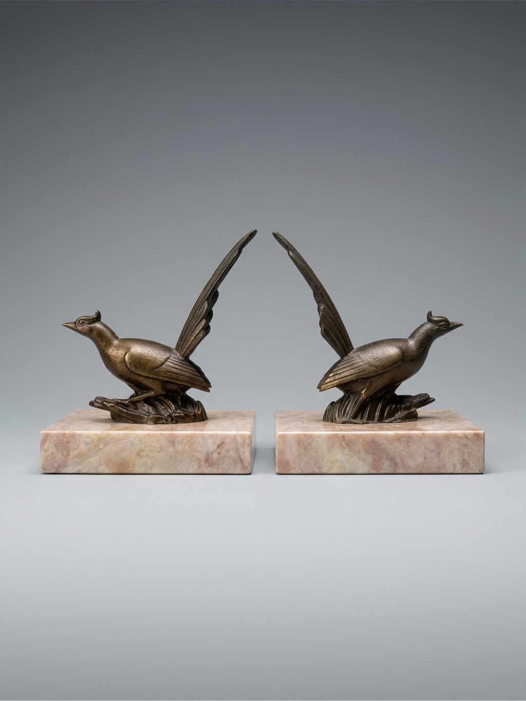 Pair of Art Deco bird bookends – patinated spelter and pink marble – vintage – 1930s