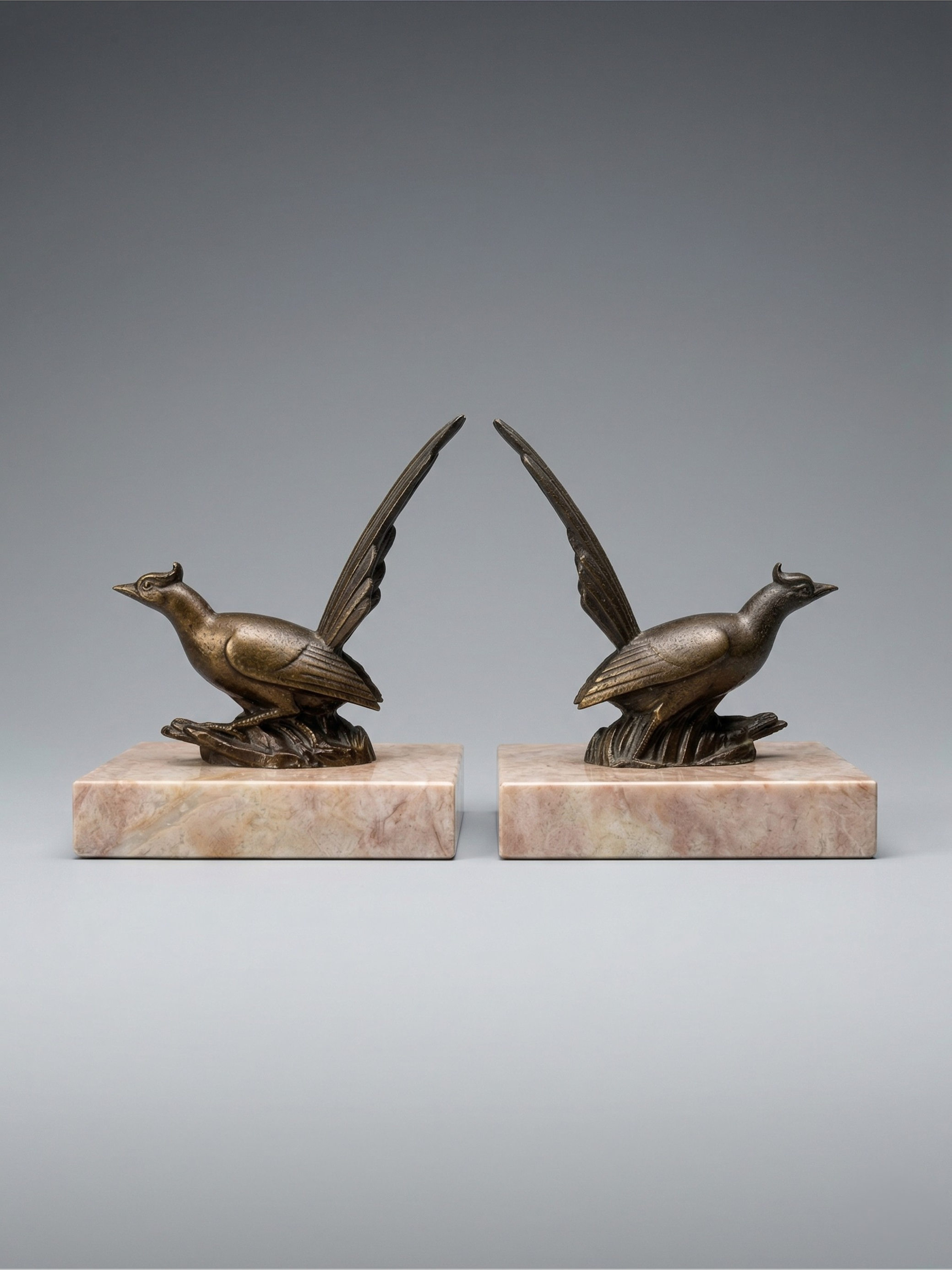 Pair of Art Deco bird bookends – patinated spelter and pink marble – vintage – 1930s