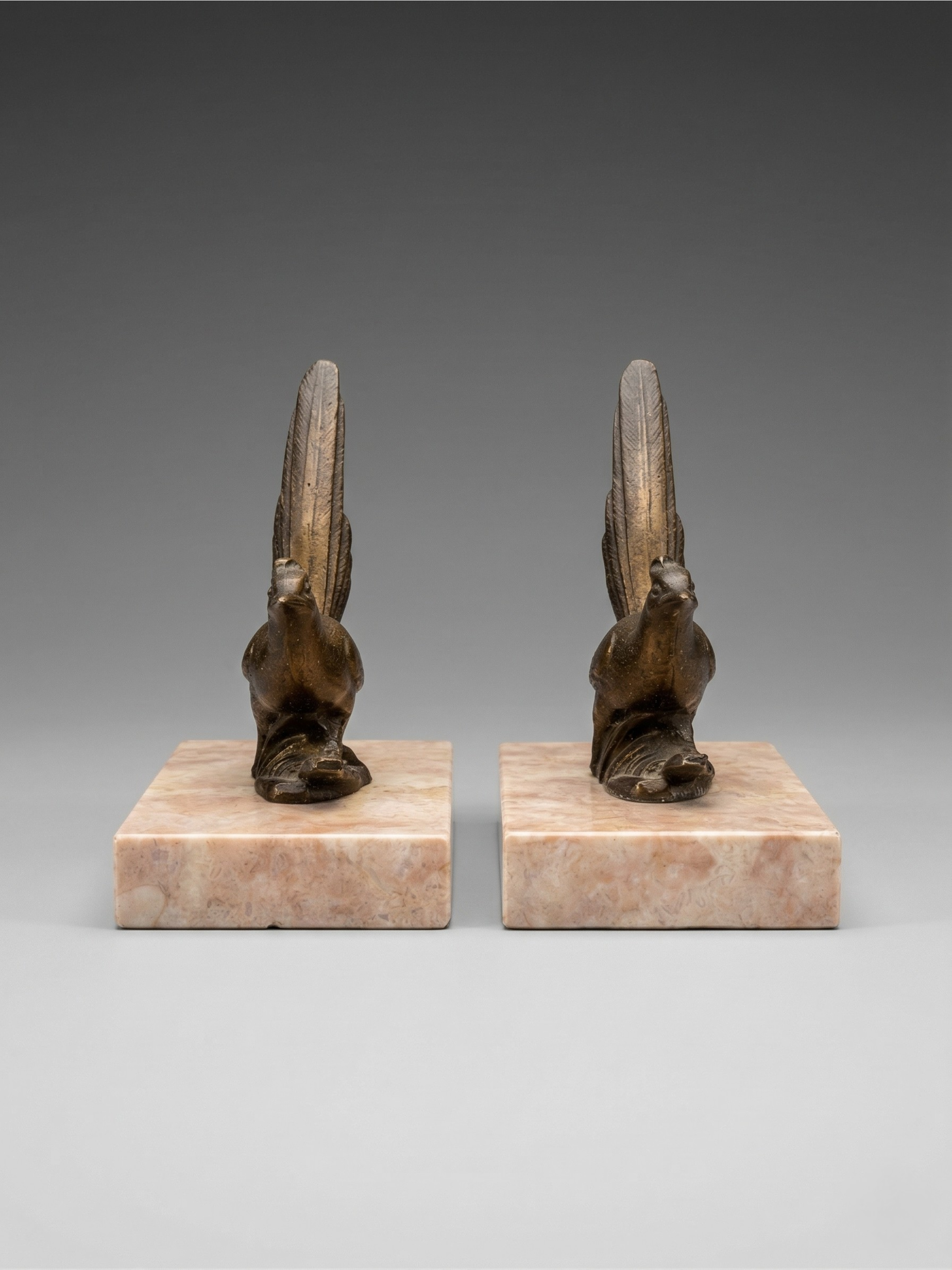 Pair of Art Deco bird bookends – patinated spelter and pink marble – vintage – 1930s
