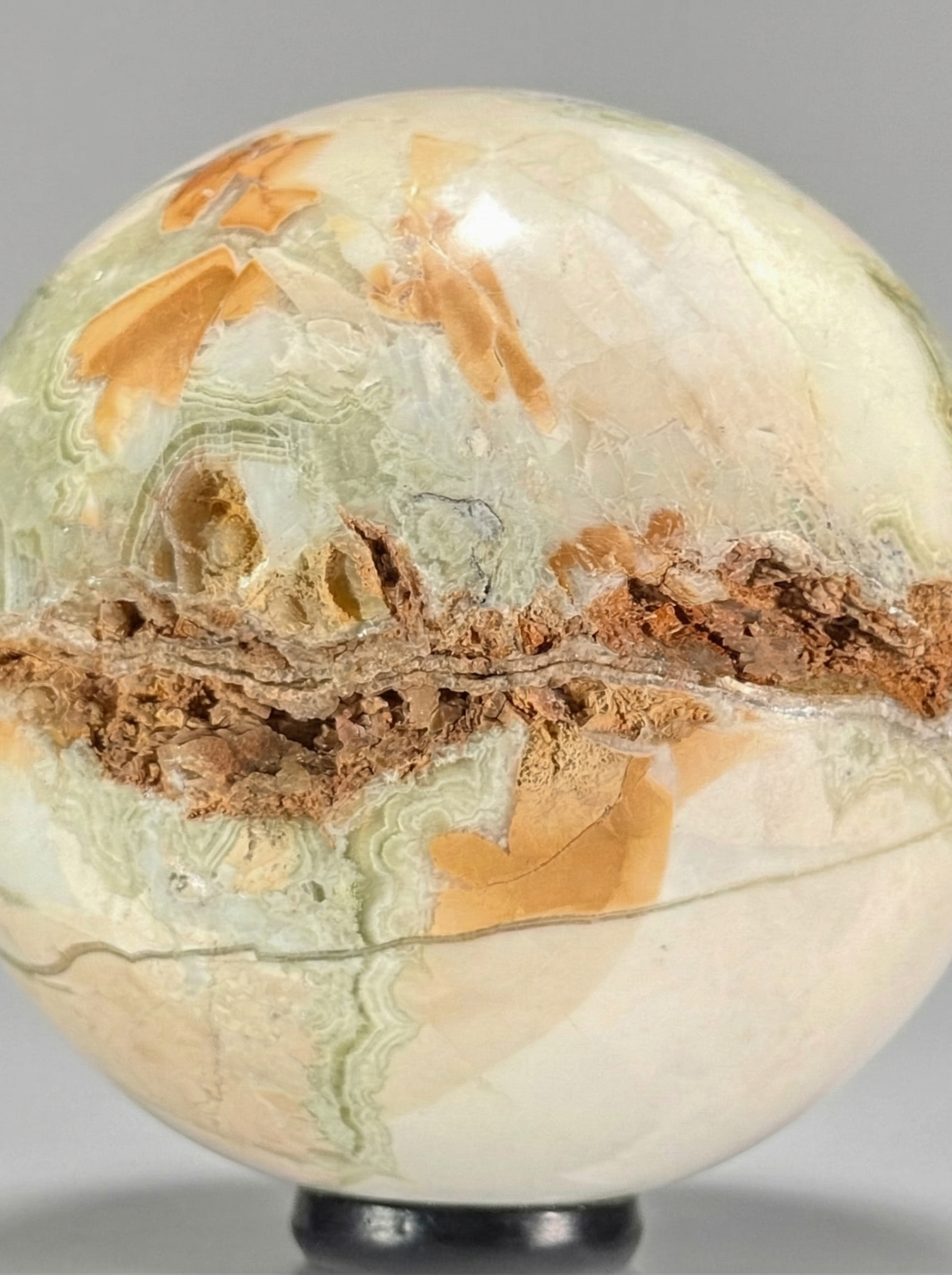 Decorative Duo — Banded calcite sphere (onyx marble) & calcite crystal on stands