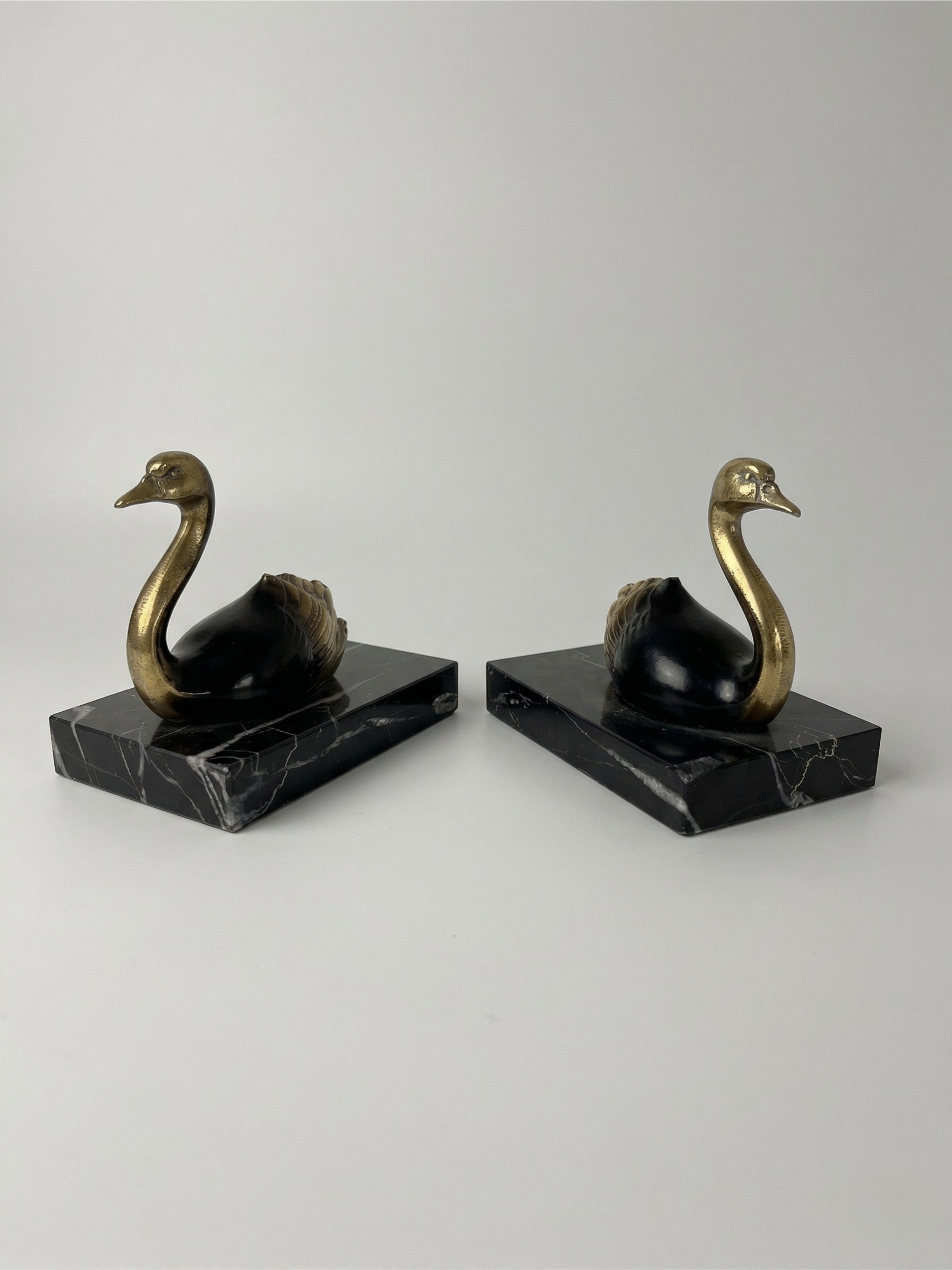 Pair of Art Deco bookends with swans in spelter and black marble – France, 1930s