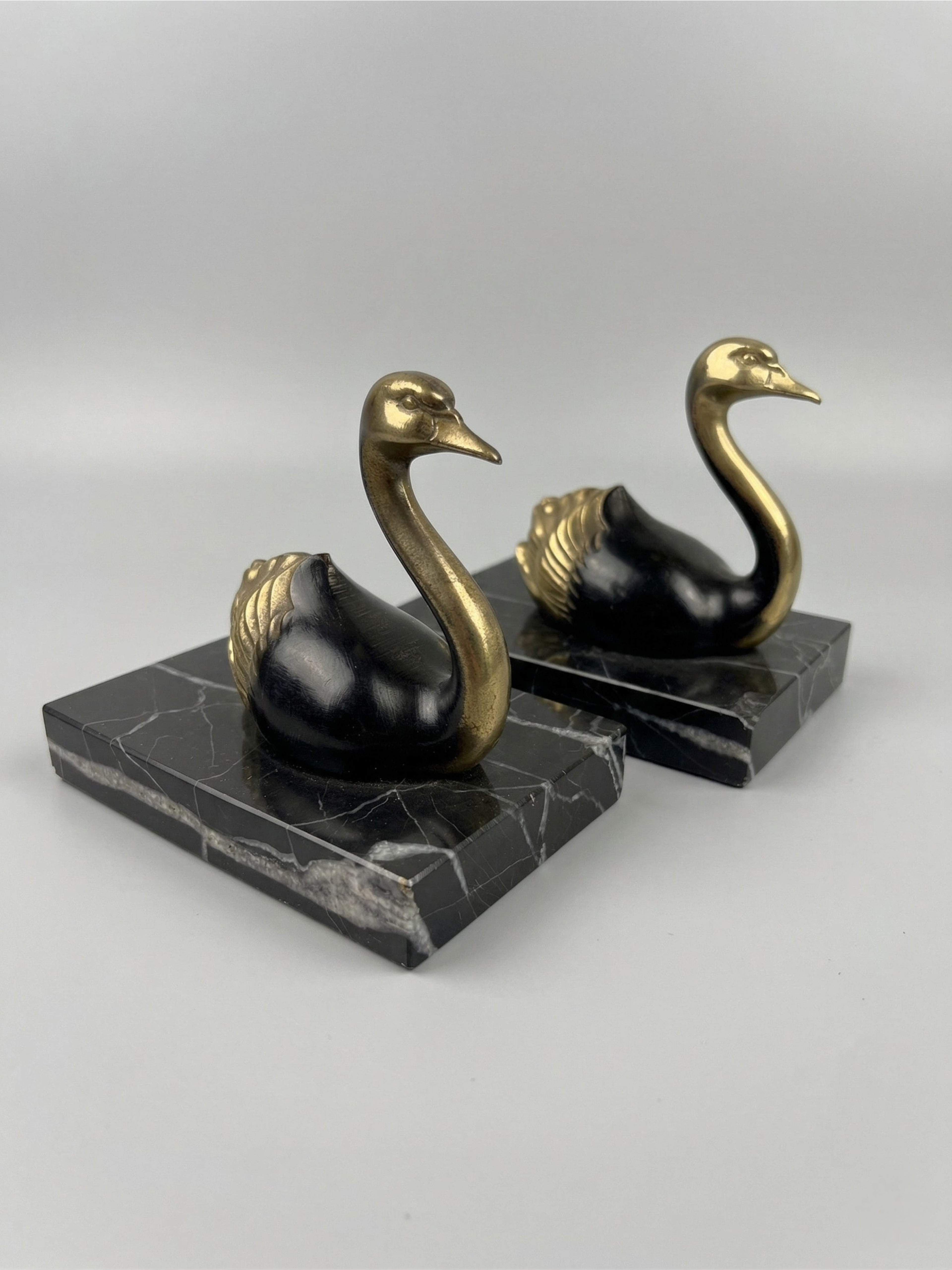Pair of Art Deco bookends with swans in spelter and black marble – France, 1930s