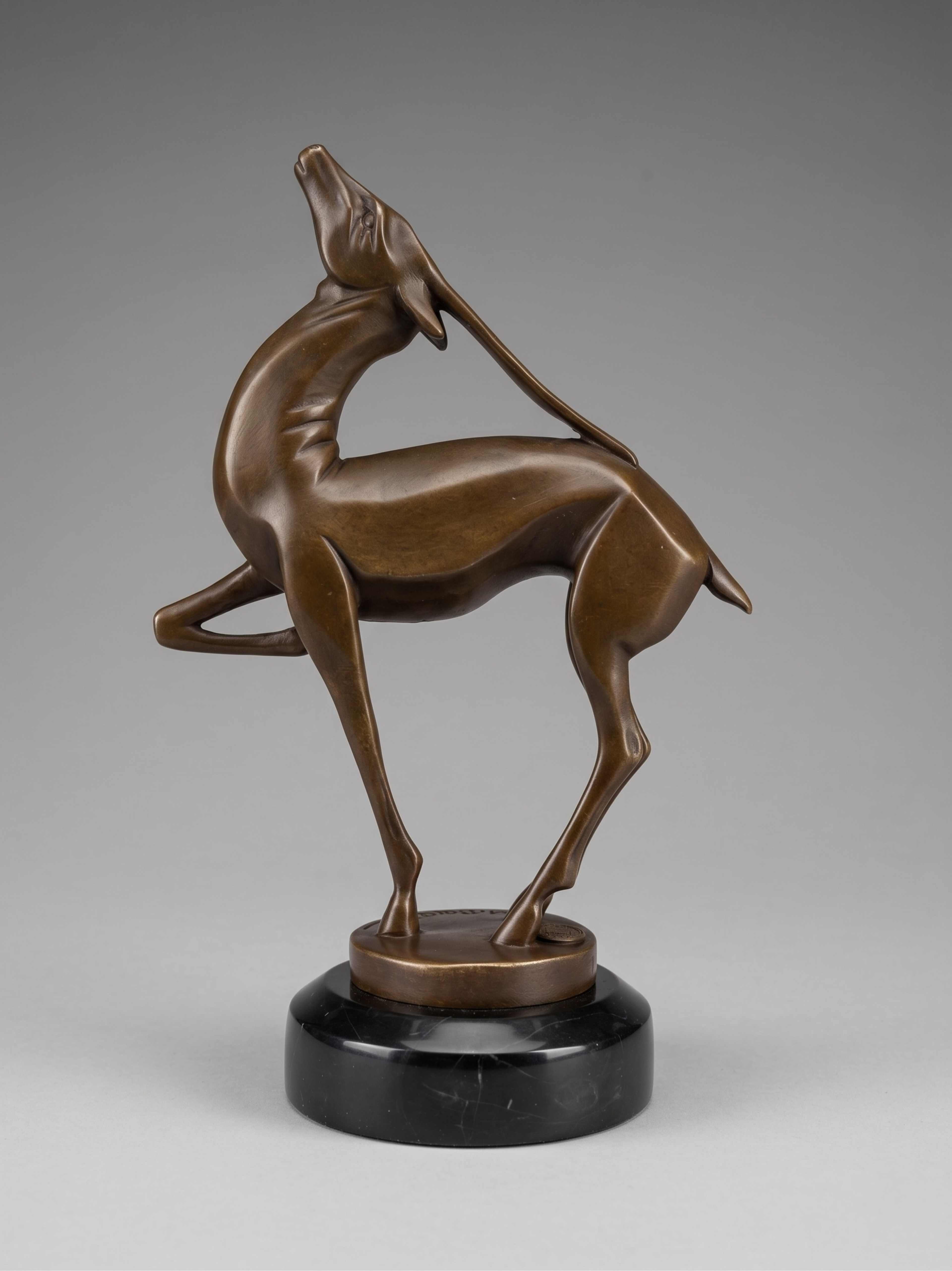 Art Deco patinated bronze antelope sculpture, after Marcel Bouraine, black marble base – 22 cm