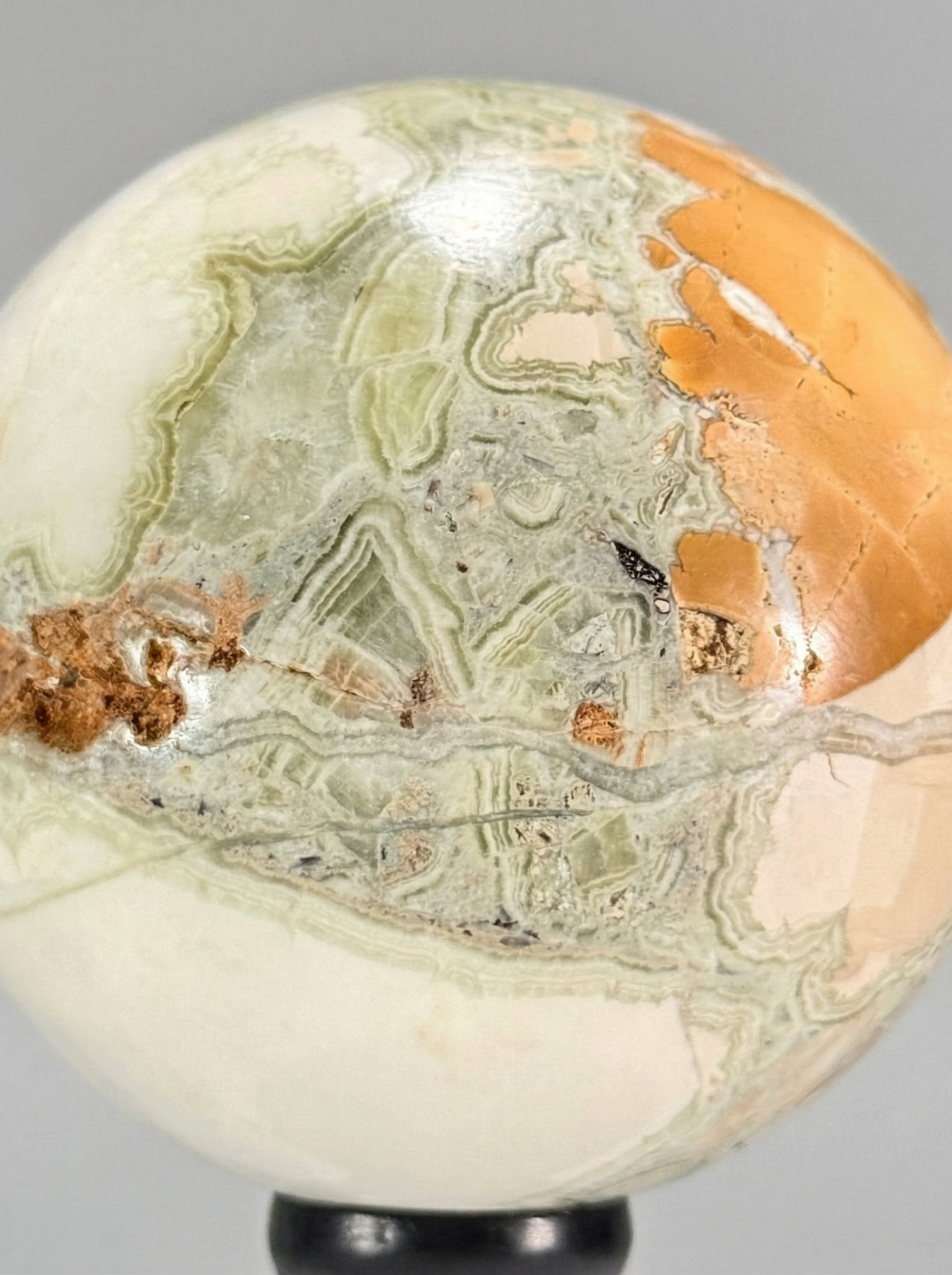 Decorative Duo — Banded calcite sphere (onyx marble) & calcite crystal on stands