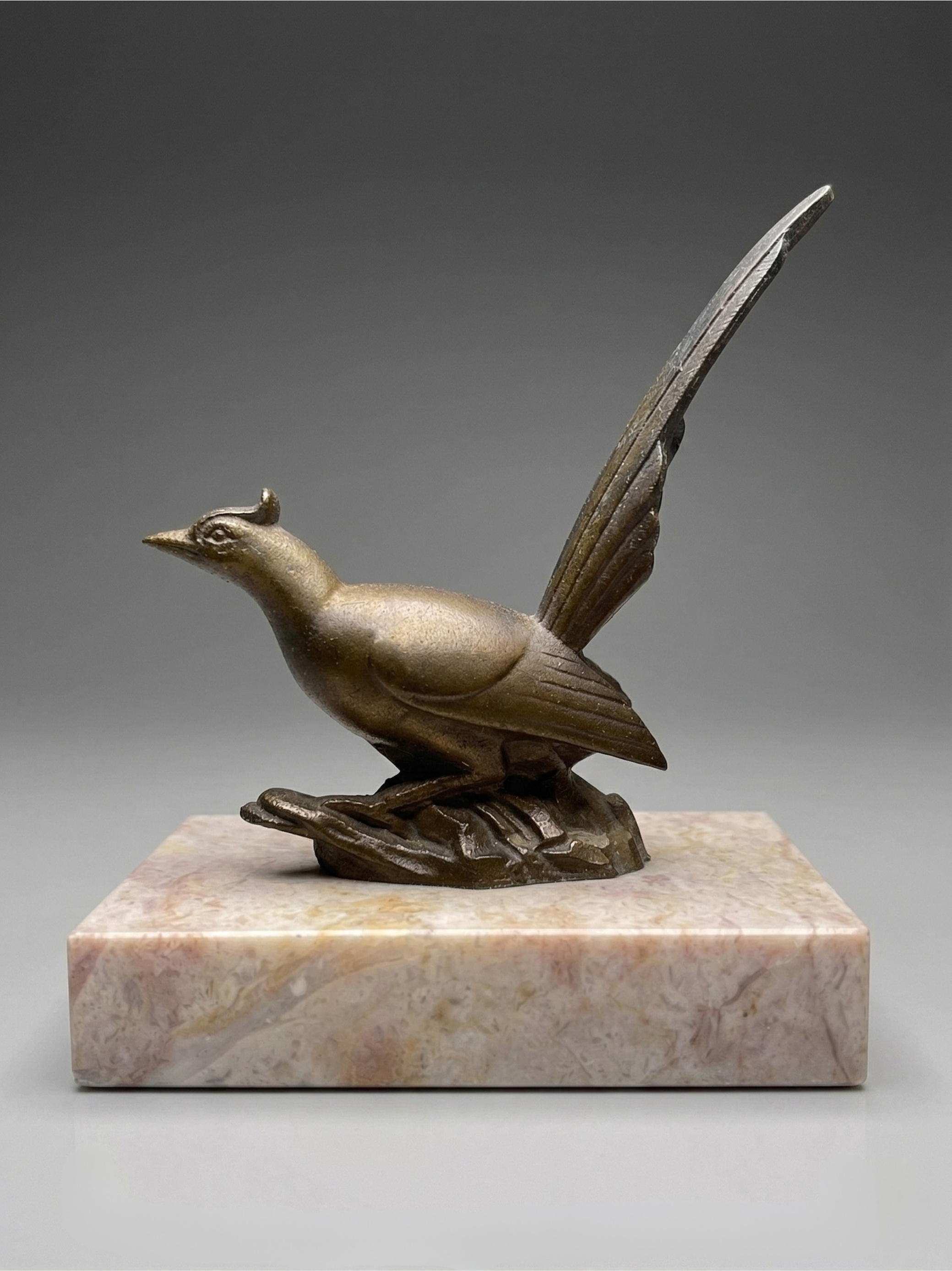 Pair of Art Deco bird bookends – patinated spelter and pink marble – vintage – 1930s