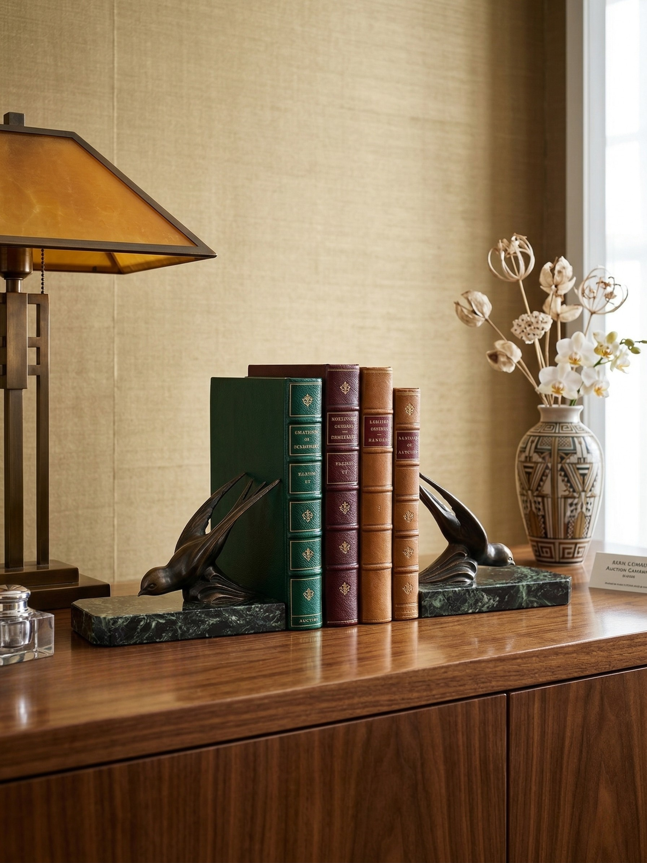 Art Deco pair of bookends – Patinated spelter swallows on green marble bases